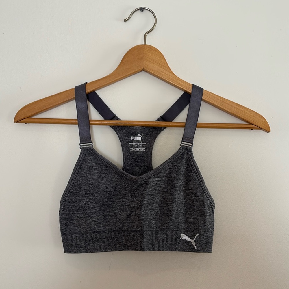 Two Puma size small sports bras. Grey and pink.